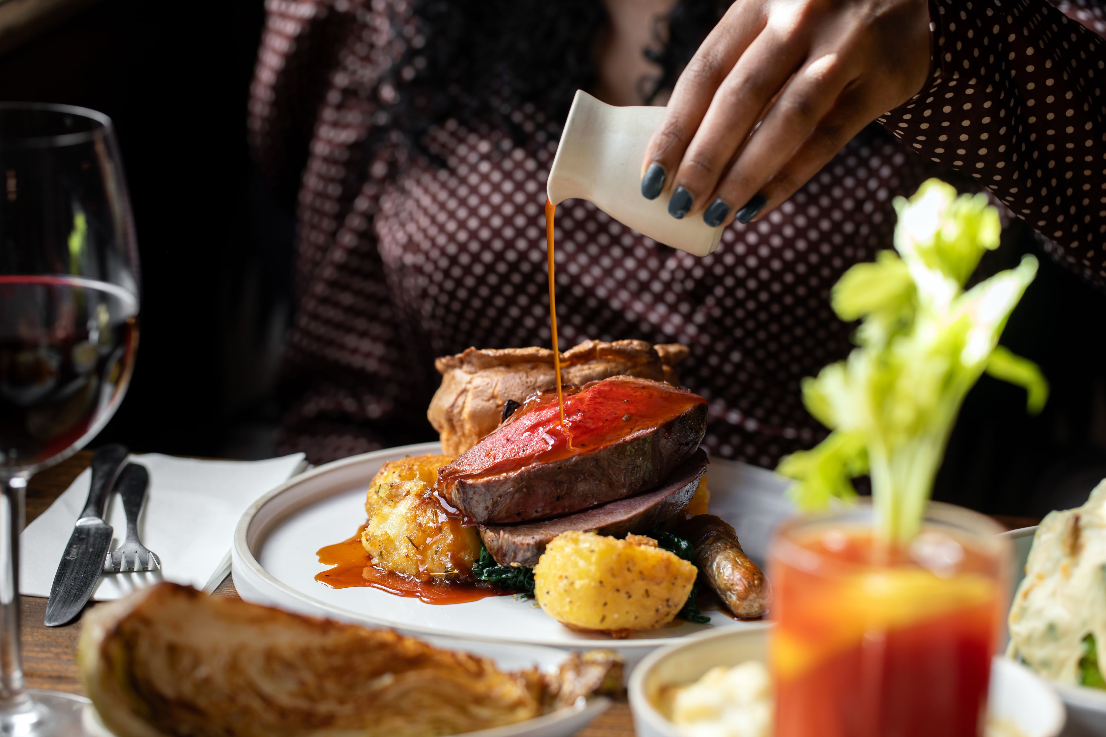 Traditional Sunday roast served at a cosy London riverside pub.